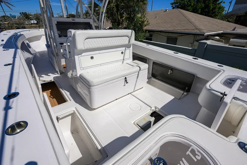 Slide: The Image of 2017 SeaHunter 33 Tournament boat interior with seating and storage compartments. - 17