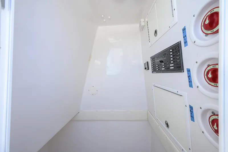 Slide: The Image of 2017 SeaHunter 33 Tournament boat interior with control panel and storage compartments. - 23