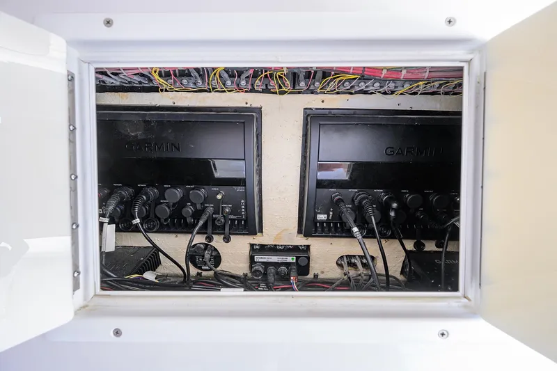 Slide: The Image of 2017 SeaHunter 33 Tournament electronics panel with Garmin displays and wiring. - 25