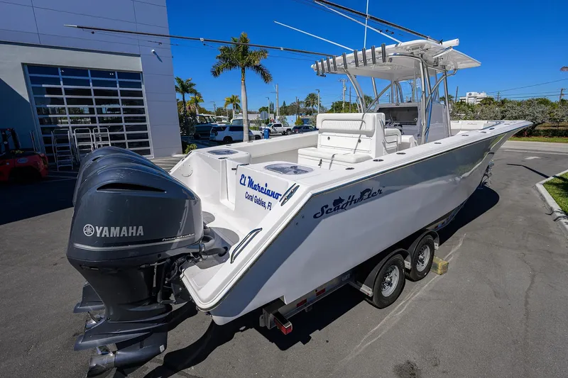 Slide: The Image of 2017 SeaHunter 33 Tournament boat with Yamaha engines, parked on a trailer. - 3