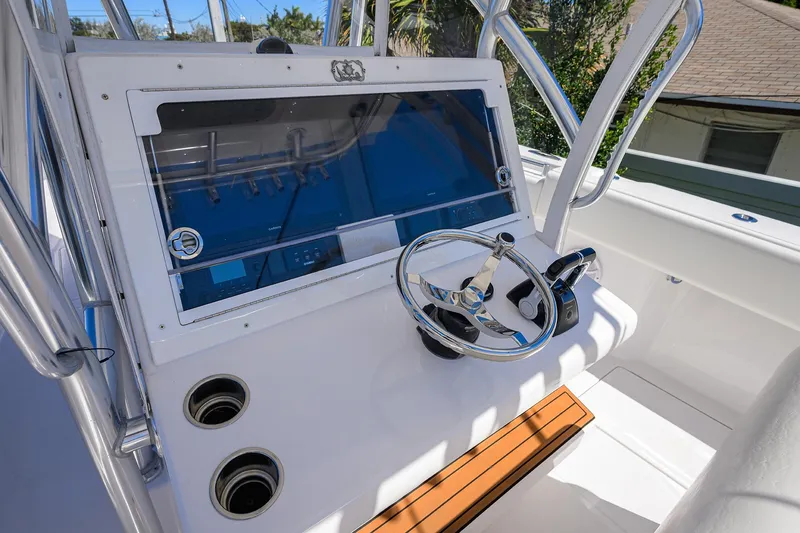 Slide: The Image of 2017 SeaHunter 33 Tournament boat helm with steering wheel and control panel. - 6
