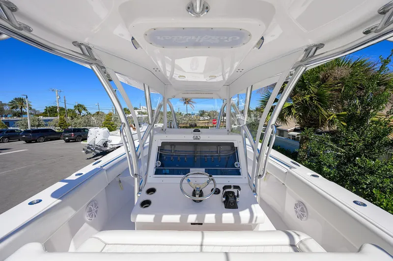 Slide: The Image of 2017 SeaHunter 33 Tournament boat interior with steering console and seating. - 8