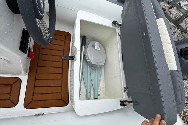 Slide: The Image of Open storage compartment in 2026 Gala A300L boat, showing interior and steering wheel. - 7