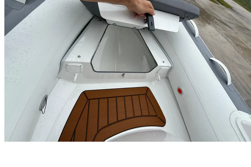 Slide: The Image of Interior view of 2026 Gala A300L boat with storage compartment and wooden flooring. - 8