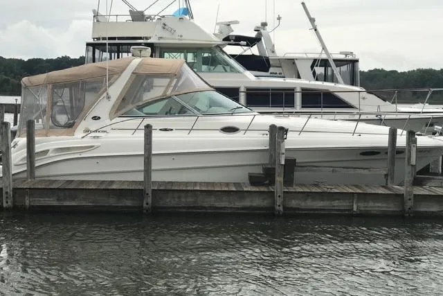 Slide: The Image of 2001 Sea Ray 340 Sundancer docked at marina, side view. - 25