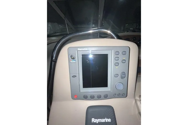 Slide: The Image of Raymarine navigation system on 2001 Sea Ray 340 Sundancer boat dashboard. - 28