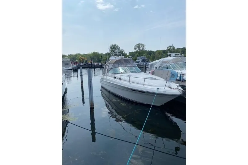 Slide: The Image of 2001 Sea Ray 340 Sundancer yacht docked in a marina on a sunny day. - 3