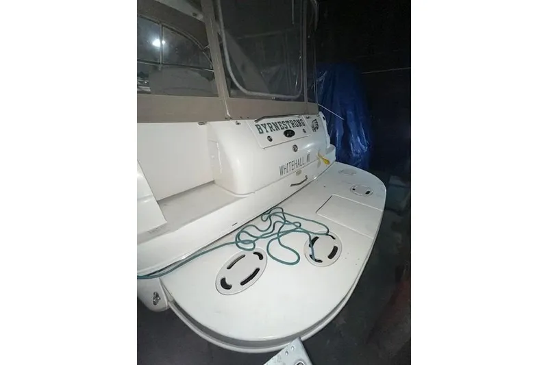 Slide: The Image of 2001 Sea Ray 340 Sundancer boat with swim platform and mooring lines. - 30