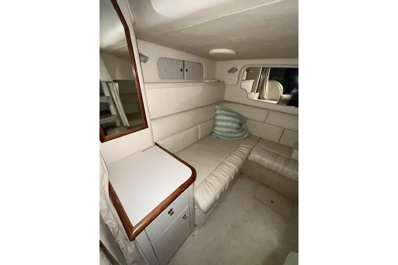 Slide: The Image of 2001 Sea Ray 340 Sundancer cabin interior with seating and storage. - 8