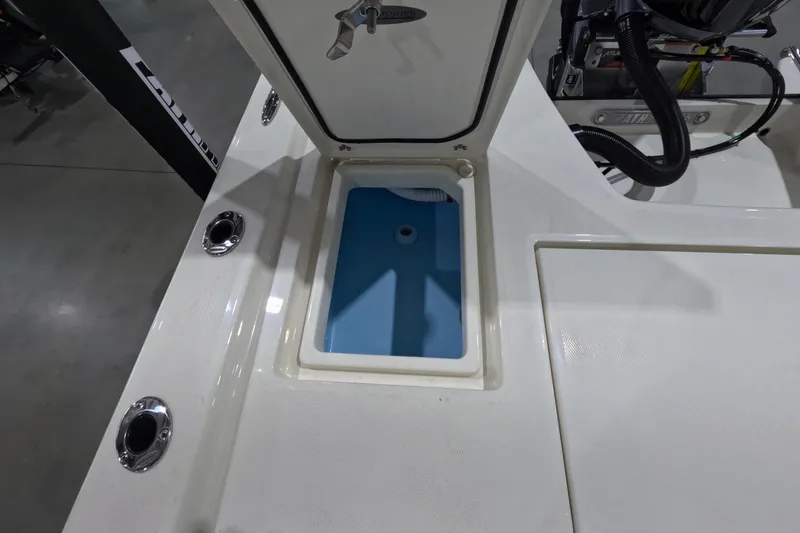 Slide: The Image of 2026 Pathfinder 2200 TRS boat interior with open storage compartment. - 12