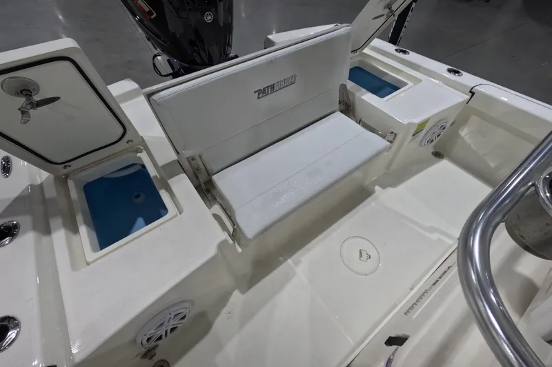 Slide: The Image of 2026 Pathfinder 2200 TRS boat interior with seating and storage compartments. - 14