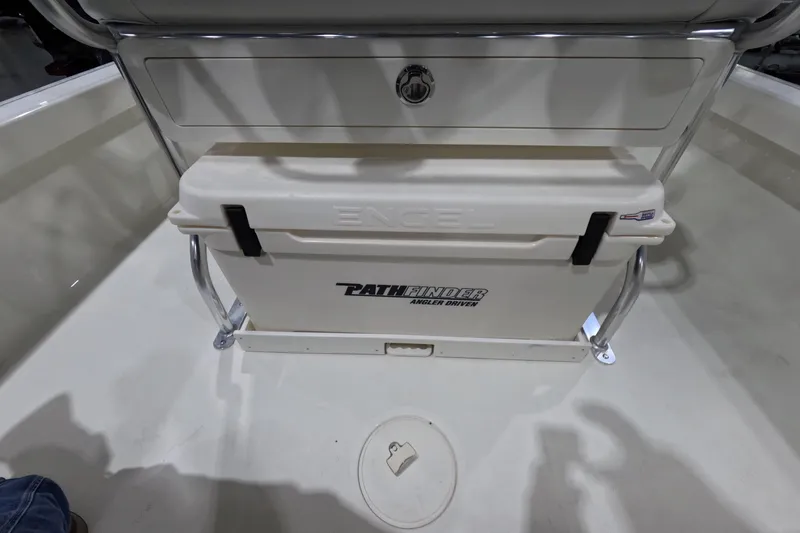 Slide: The Image of 2026 Pathfinder 2200 TRS boat interior with Engel cooler and storage compartment. - 16