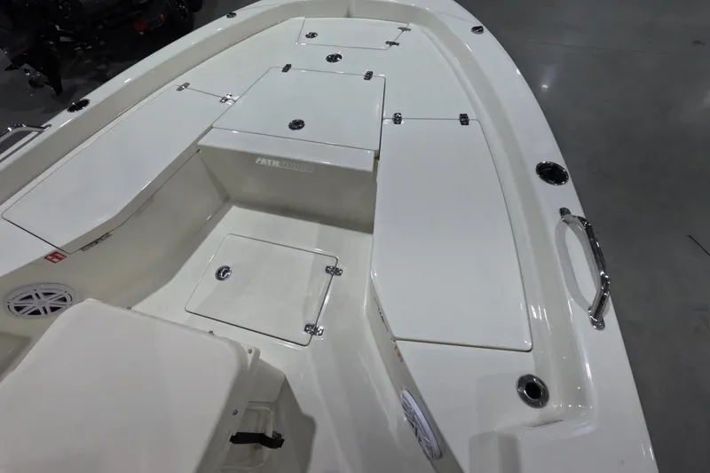 Slide: The Image of 2026 Pathfinder 2200 TRS boat interior with storage compartments and seating. - 18