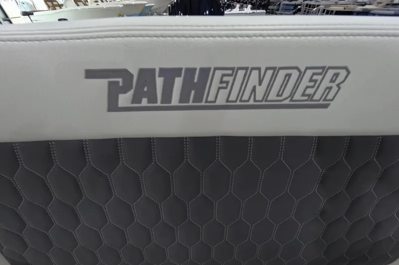 Slide: The Image of 2026 Pathfinder 2200 TRS boat seat with logo and hexagonal stitching design. - 22