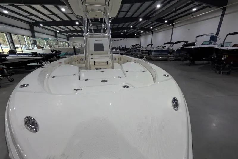 Slide: The Image of 2026 Pathfinder 2200 TRS boat displayed in a spacious indoor showroom. - 7