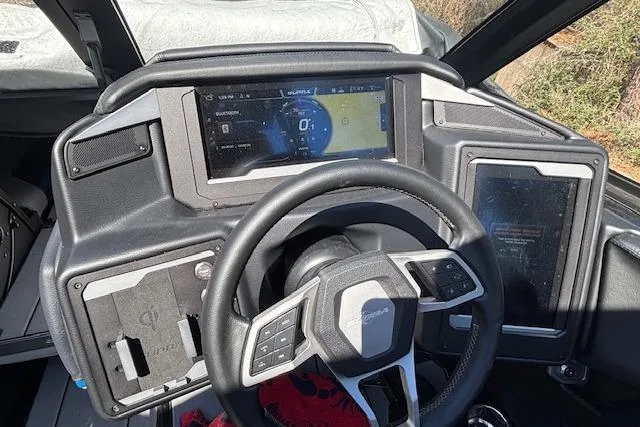 Slide: The Image of 2024 Supra SE 550 dashboard with advanced digital displays and modern steering wheel design. - 11