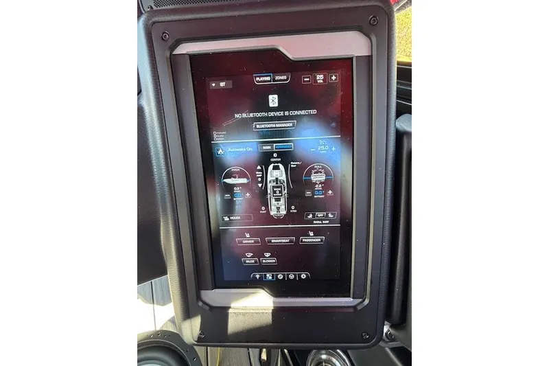 Slide: The Image of 2024 Supra SE 550 touchscreen display showing control interface and Bluetooth connectivity options. - 13
