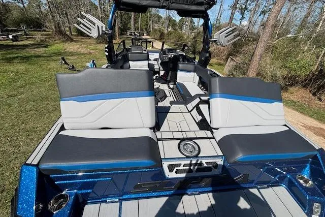 Slide: The Image of 2024 Supra SE 550 boat interior with sleek seating and modern design. - 5