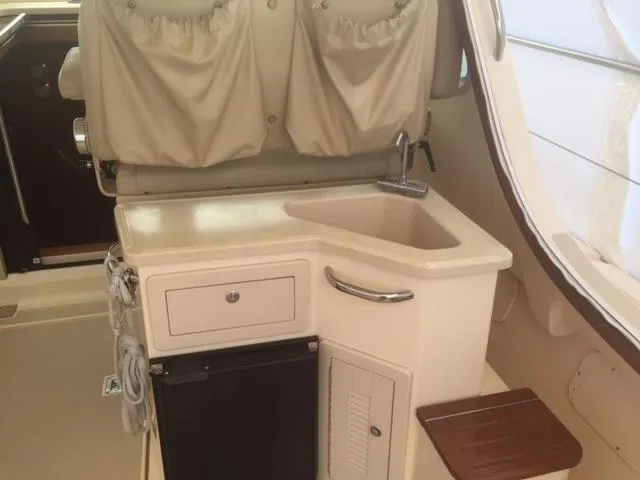 Slide: The Image of Interior of 2002 Island Packet Packet Craft Express 360 with sink and storage. - 16