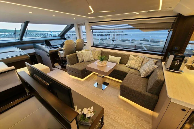 Slide: The Image of Luxurious interior of 2023 Sunseeker Manhattan 68 yacht with modern seating and panoramic windows. - 10