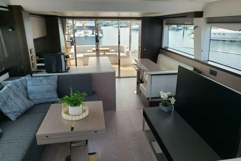 Slide: The Image of Luxurious interior of 2023 Sunseeker Manhattan 68 yacht with modern furnishings and marina view. - 19