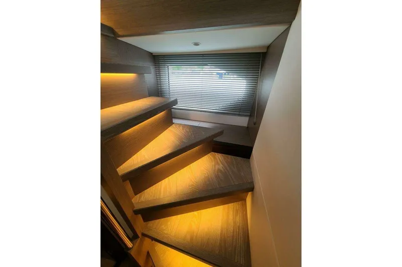 Slide: The Image of Staircase with ambient lighting on 2023 Sunseeker Manhattan 68 yacht interior. - 20