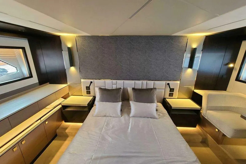Slide: The Image of Luxurious bedroom interior of 2023 Sunseeker Manhattan 68 yacht, featuring modern design and ambient lighting. - 24