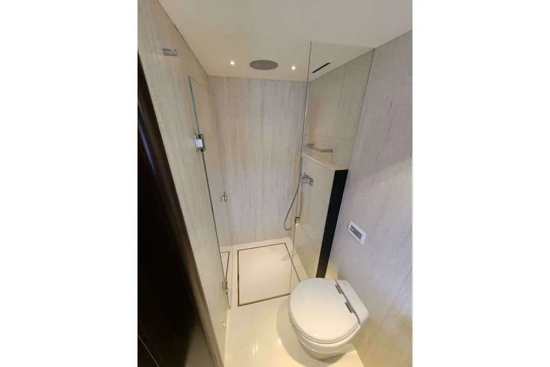 Slide: The Image of Luxurious bathroom in 2023 Sunseeker Manhattan 68 yacht, featuring modern shower and toilet. - 27