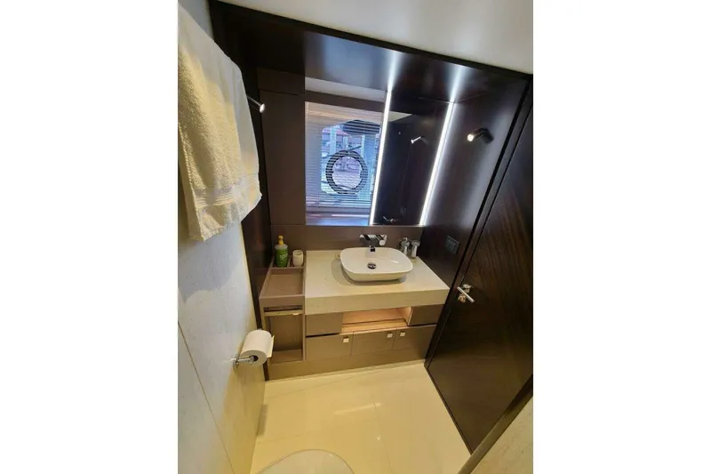 Slide: The Image of Luxurious bathroom in 2023 Sunseeker Manhattan 68 yacht, featuring modern fixtures and elegant design. - 28
