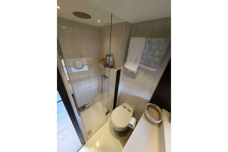 Slide: The Image of Luxurious bathroom in 2023 Sunseeker Manhattan 68 yacht, featuring modern shower and toilet. - 32