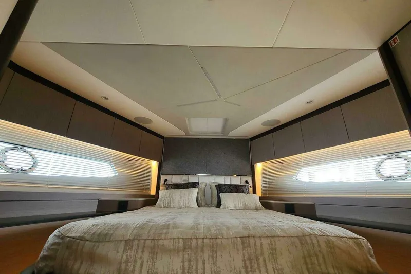 Slide: The Image of Luxurious bedroom interior of 2023 Sunseeker Manhattan 68 yacht, featuring modern design and ambient lighting. - 34