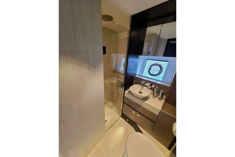 Slide: The Image of Luxurious bathroom in 2023 Sunseeker Manhattan 68 yacht, featuring modern fixtures and elegant design. - 37