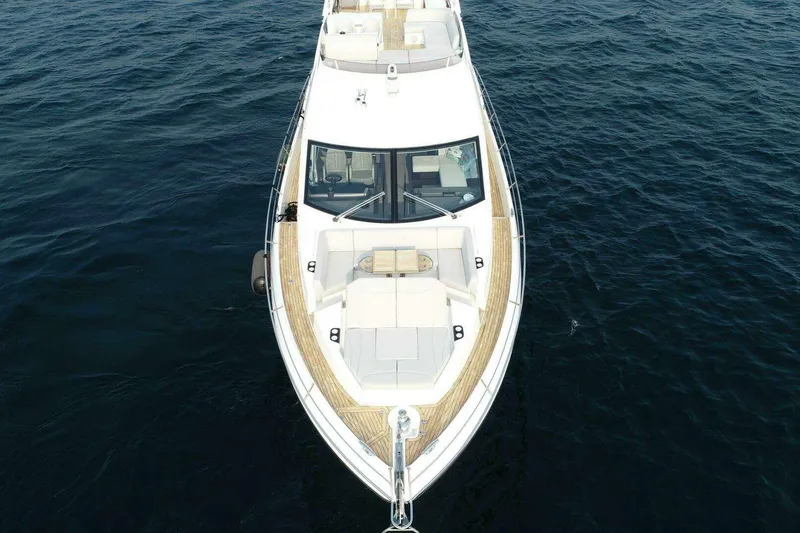 Slide: The Image of 2023 Sunseeker Manhattan 68 yacht on open water, aerial view. - 4