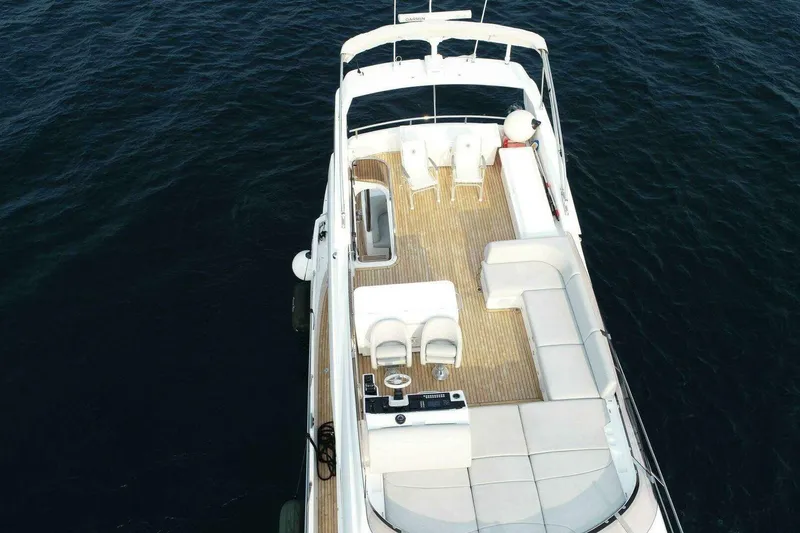 Slide: The Image of 2023 Sunseeker Manhattan 68 yacht, aerial view of deck and seating area. - 5