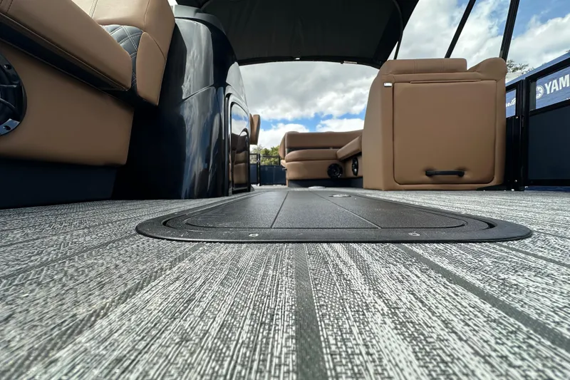 Slide: The Image of 2026 Ranger Reata 223FC boat interior with modern seating and textured flooring. - 10