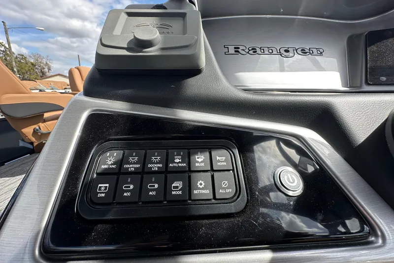 Slide: The Image of Control panel of 2026 Ranger Reata 223FC boat with various function buttons. - 12