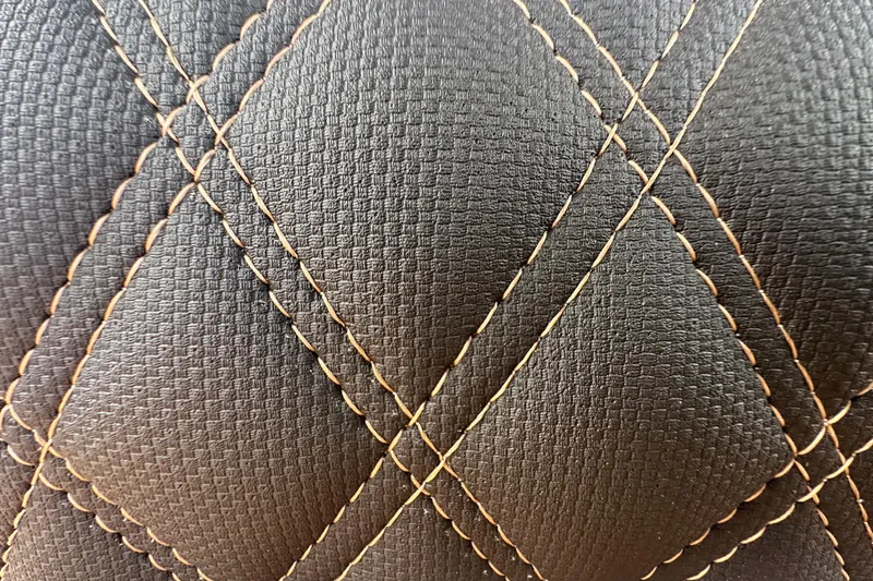 Slide: The Image of Quilted leather upholstery detail from 2026 Ranger Reata 223FC. - 34