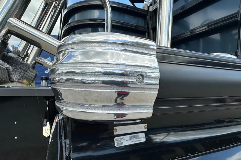 Slide: The Image of 2026 Ranger Reata 223FC boat detail with chrome accents and sleek black finish. - 37