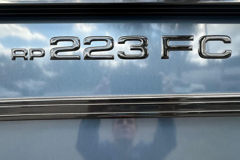 Slide: The Image of Close-up of 2026 Ranger Reata 223FC model emblem on metallic surface. - 4