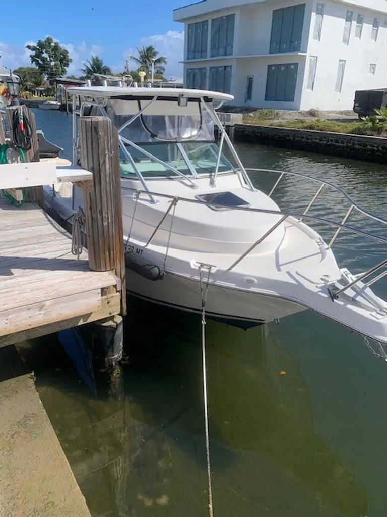 The Image of 2005 Robalo R235 WA boat docked on a sunny day. - 0