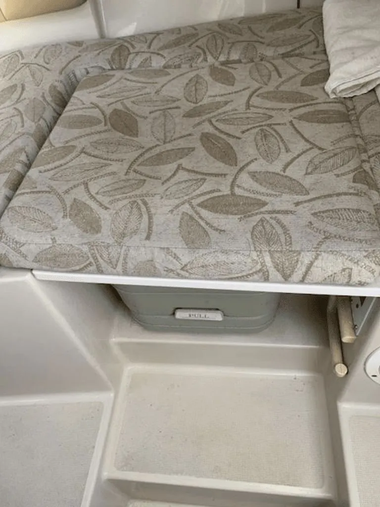 Slide: The Image of Interior of a 2005 Robalo R235 WA with patterned upholstery. - 10