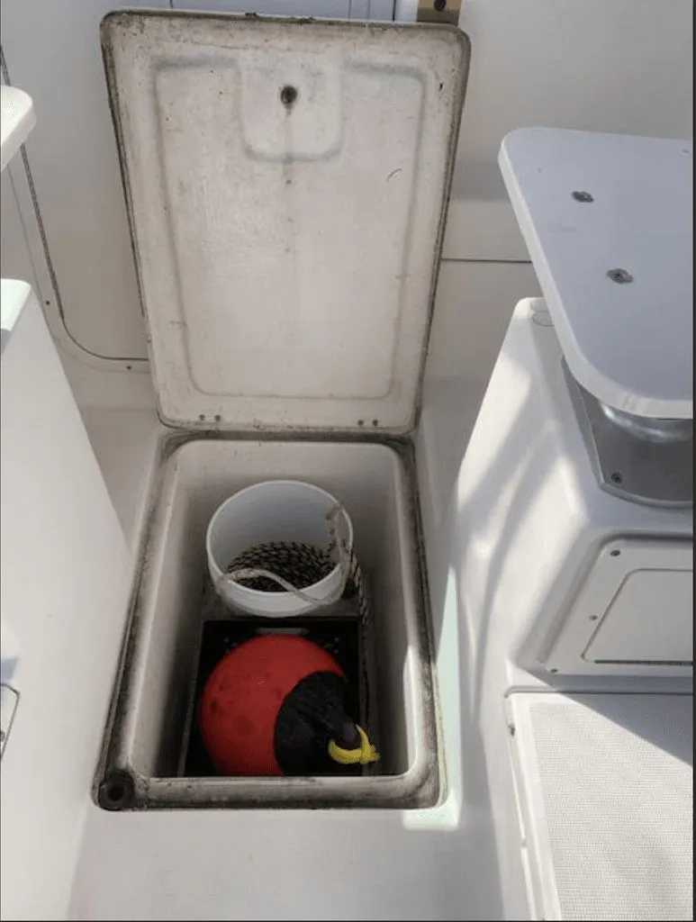 Slide: The Image of Storage compartment in 2005 Robalo R235 WA boat. - 16