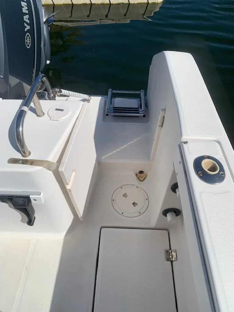 Slide: The Image of 2005 Robalo R235 WA boat deck with Yamaha engine. - 7