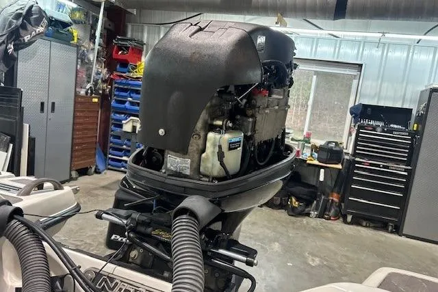 Slide: The Image of 2008 Nitro 189 Sport boat engine in a workshop setting. - 10