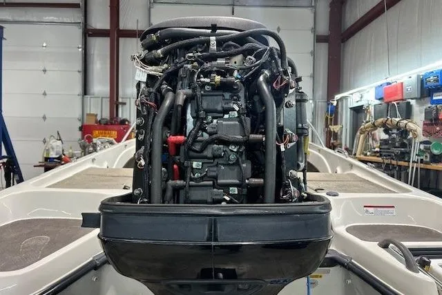 Slide: The Image of 2008 Nitro 189 Sport boat engine in a workshop setting. - 8