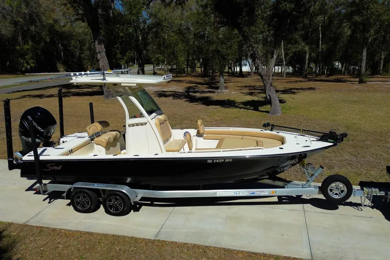 Slide: The Image of Close-up of 2019 Scout 251 XSS boat logo on window. - 27