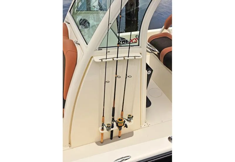 Slide: The Image of 2019 Scout 251 XSS boat interior with tan seating and outboard motor. - 7
