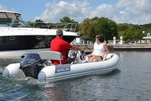 Slide: The Image of 2024 Gala A330L inflatable boat cruising on a sunny day with two passengers. - 4