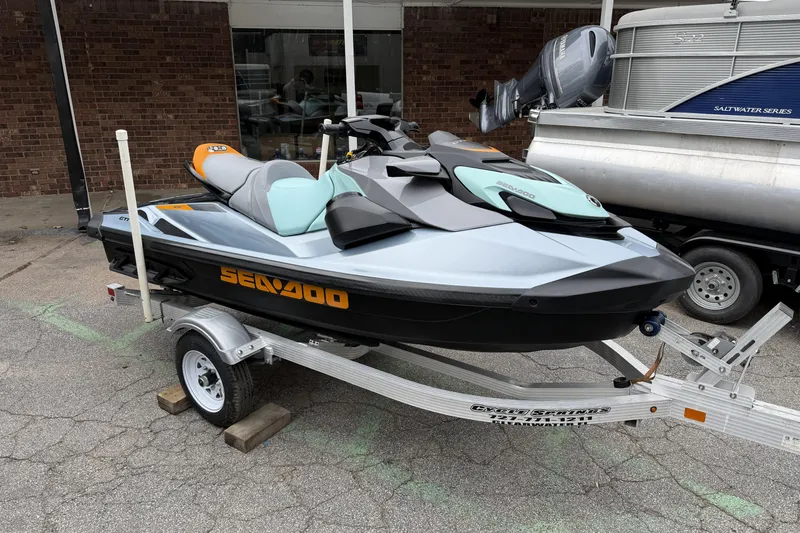 Slide: The Image of 2024 Sea-Doo GTI SE 170 jet ski on trailer, parked outdoors. - 7