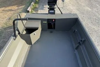 Slide: The Image of 2026 Gator Tail 1748 Gator Series boat interior with steering console and seating. - 10